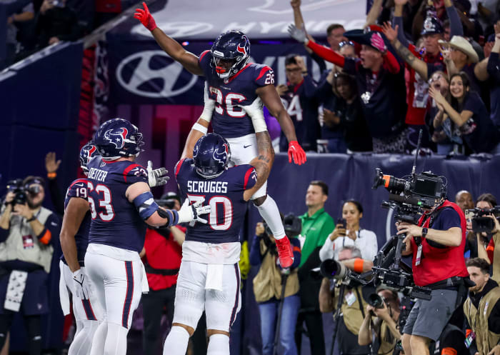 Texans running back Devin Singletary (26) celebrates scoring a touchdown during the fourth quarter in a 2024 AFC wild card game at NRG Stadium.